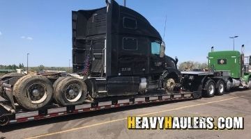Shipping a Volvo sleeper truck on an RGN trailer.