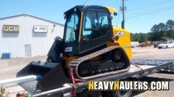 Transporting a new JCB skid steer loader.