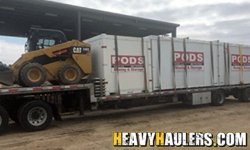 Transportation of a Caterpillar skid steer.