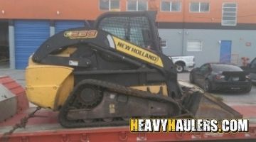 Hauling a New Holland skid steer loader.