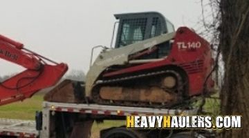 Takeuchi skid steer loader haul.