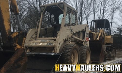 Hauling a Bobcat skid steer.