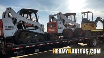 Hauling a Bobcat skid steers and a Bobcat track loader.