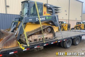 John Deere 329e skid steer haul.