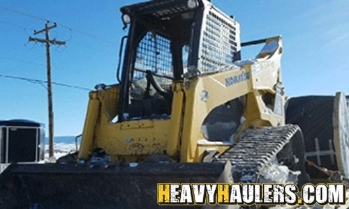 Transporting a Komatsu skid steer.