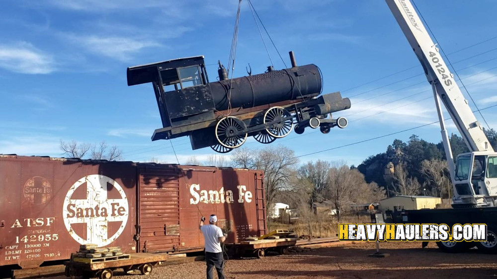 Locomotive loaded with a crane.