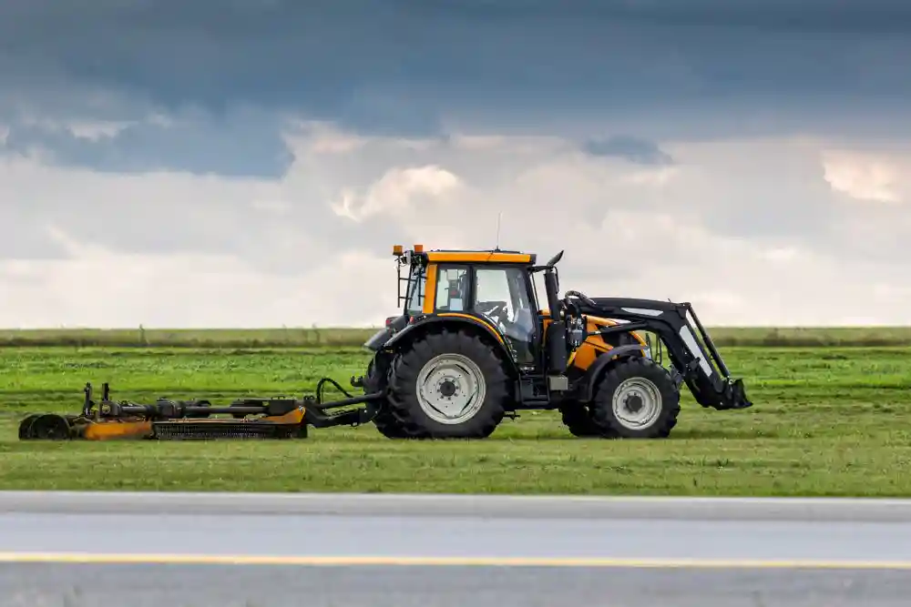 Mower in field