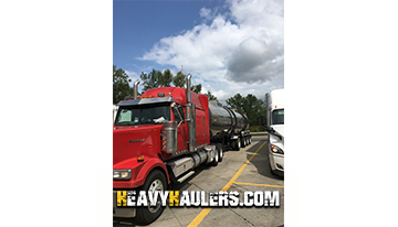 Loading a fuel truck for transport.