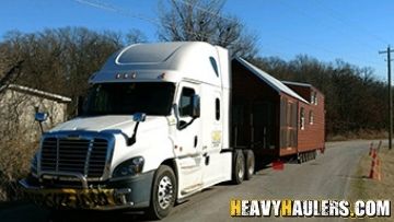 Tiny home transported by a semi truck.