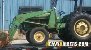 Hauling a John Deere tractor.