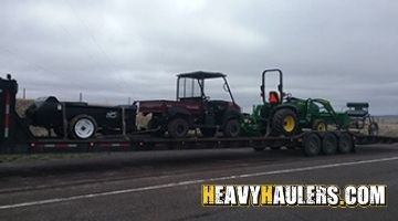 Loading a John Deere tractor on a hotshot trailer.