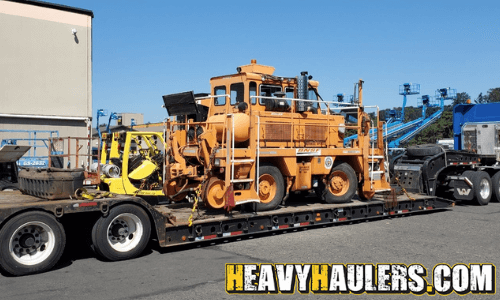 shuttle wagon transported on a lowboy trailer