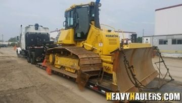 Crawler transport on an RGN trailer.