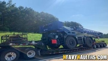 Loading a Tadano TR800XXL crane on an RGN trailer.