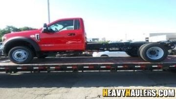 Transporting a heavy duty truck on a flatbed trailer.