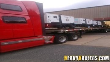 Hauling generators on a fltabed trailer.