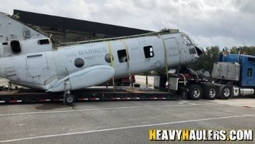 Heavy haulers transporting a marine fuselage