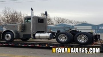 Transporting a Peterbilt day cab truck on a trailer from Indiana.