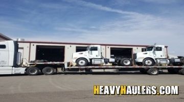 Transporting a Peterbilt sigle axle day cab on a trailer in Colorado.