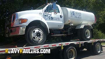 A water wagon being hauled