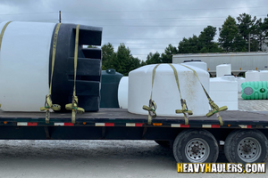 2 tanks and 1 stand hauled on a flatbed trailer to Texas