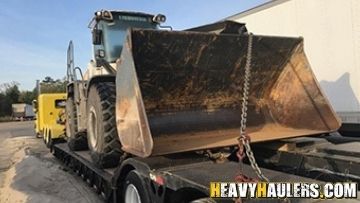 Wheel loader haul on an RGN trailer.