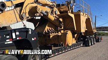 Hauling an oversize Caterpillar wheel loader.