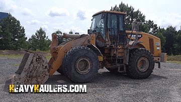 Hauling a Caterpillar 966H wheel loader.