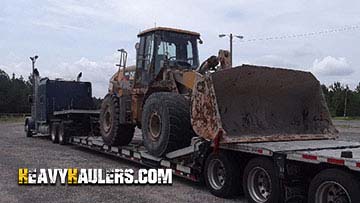 Caterpillar 966H wheel loader being transported on a 6 axle RGN trailer