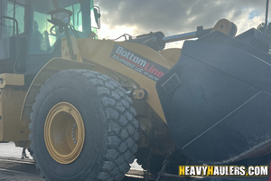 Hauling a CAT 950 GC wheel loader.