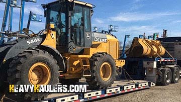 Hauling a John Deere 544K wheel loader.