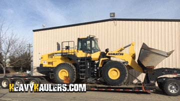 Transporting a Komatsu WA500-7 wheel loader.