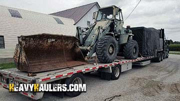 Loading a Terex wheel loader on a trailer.