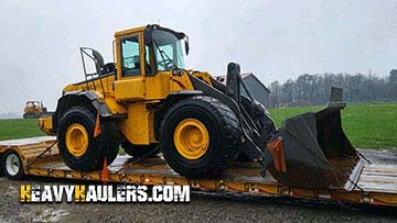 Loading a Volvo wheel loader on a trailer.