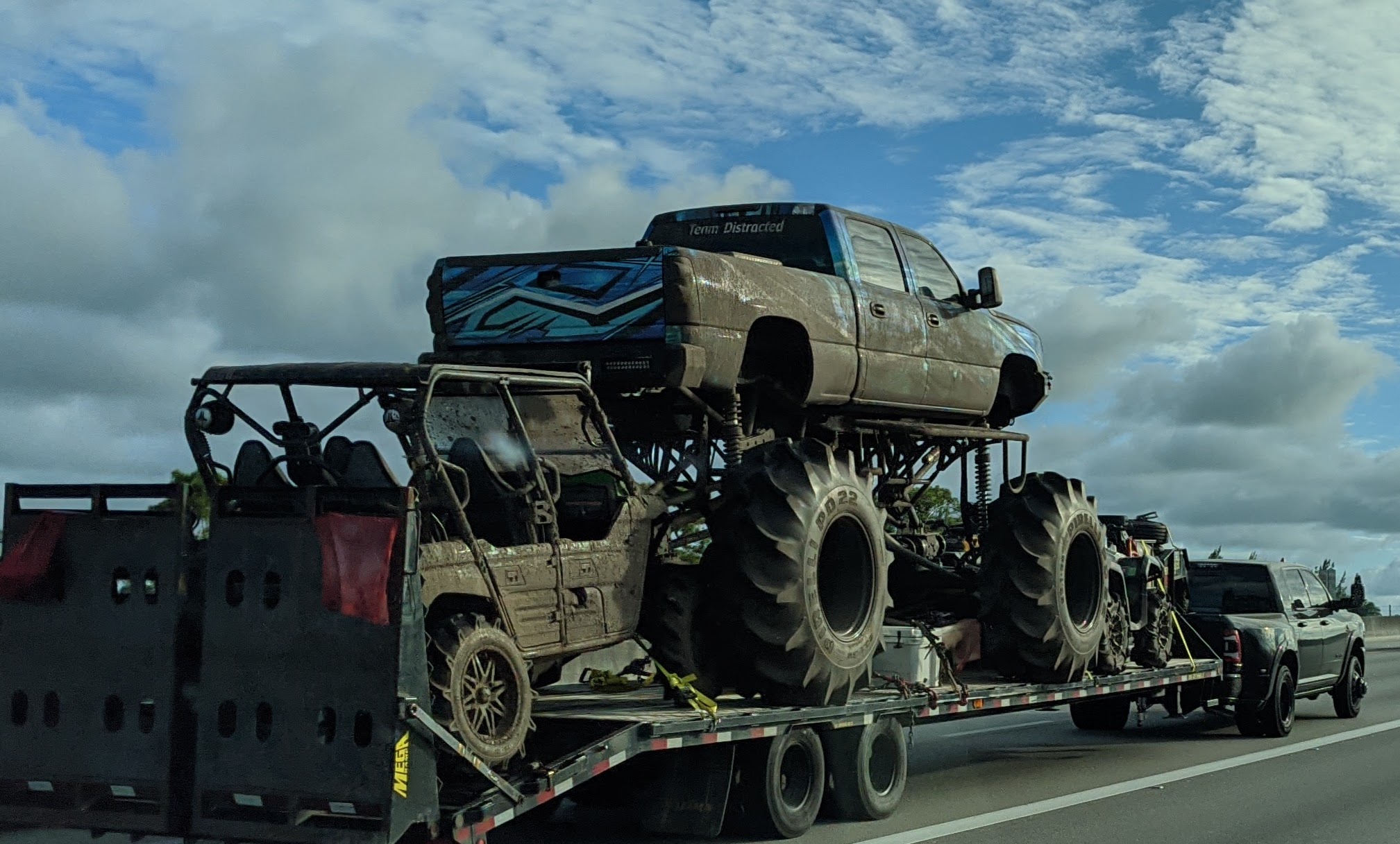 Loading a monster truck on a hotshot trailer.