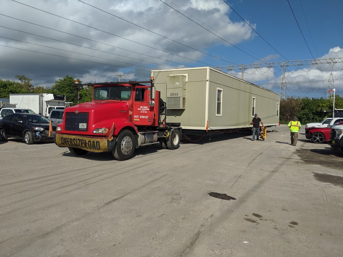 2019 TICO Spotter Trucks transported on an RGN trailer